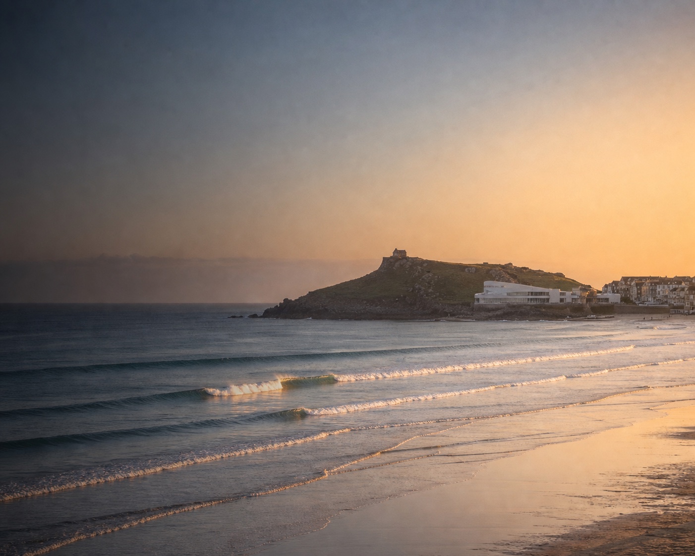 Porthmeor surf beneath Tate St Ives and St Nicholas Chapel on The Island