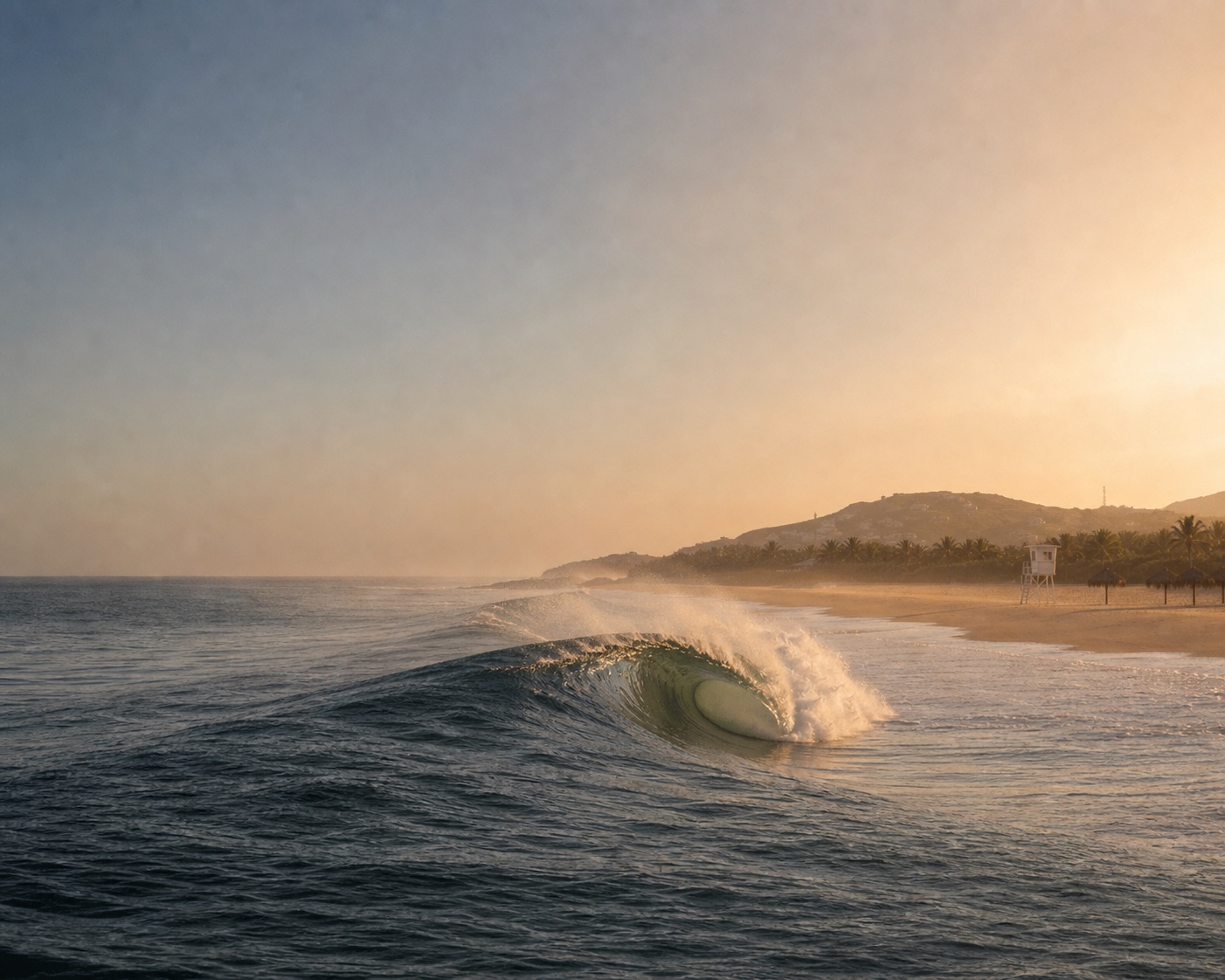A hollow Zicatela barrel beside Puerto Escondido's beach and lifeguard tower