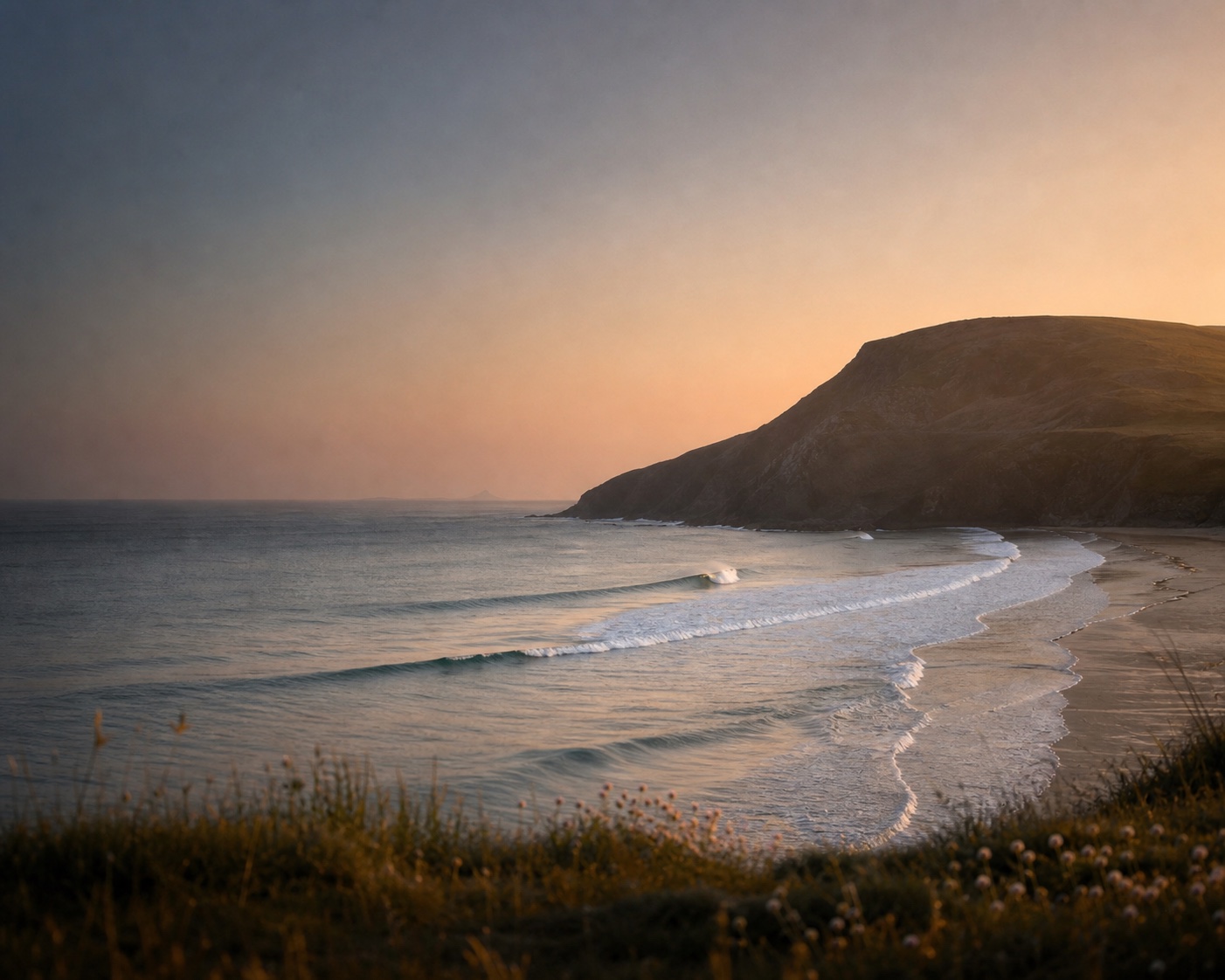 Putsborough surf sweeping beneath the massive slopes of Baggy Point