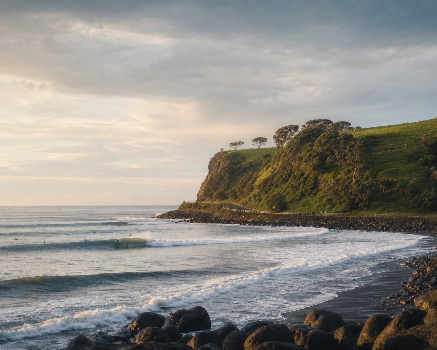 Long left-breaking waves and black volcanic sand at Raglan's Manu Bay