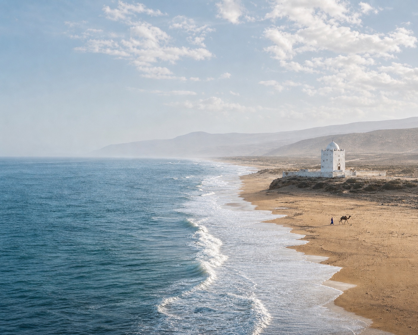 Sidi Kaouki surf beside its white marabout mausoleum