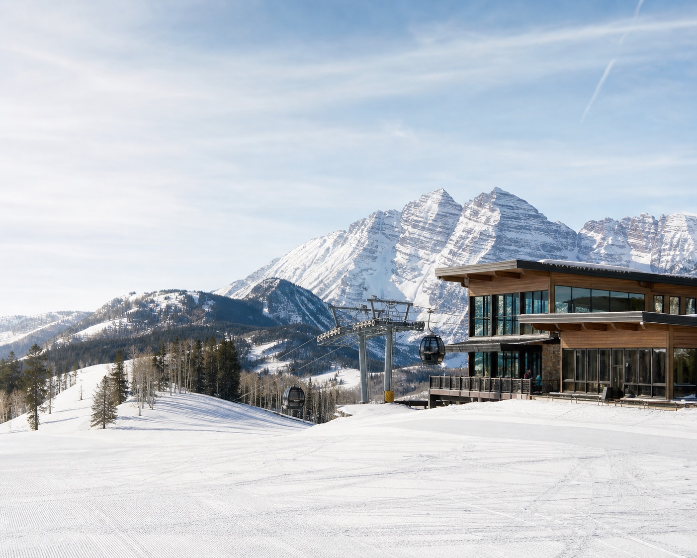 Snowmass gondola and Elk Camp lodge before the distant Maroon Bells