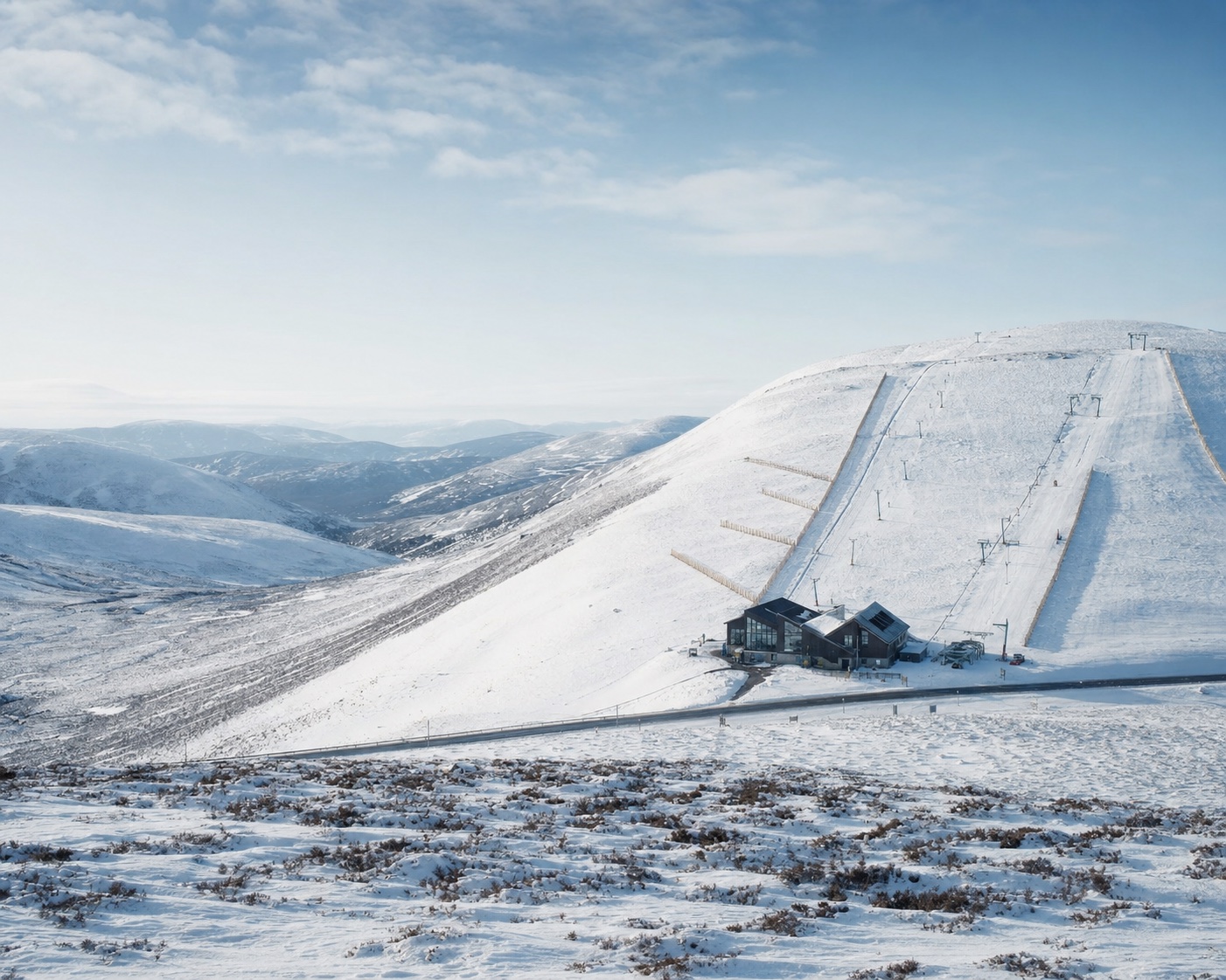 The Lecht ski centre straddling its snowy Cairngorm pass