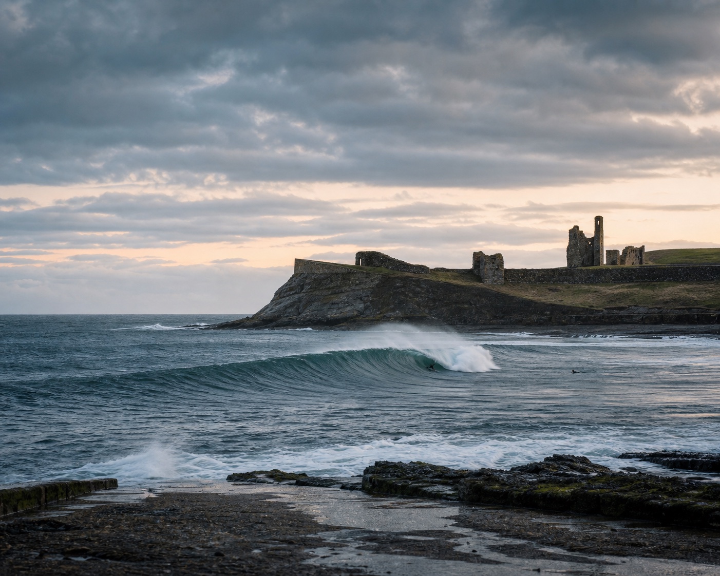 A reef wave breaking below the ruins of Thurso Castle on the Caithness coast