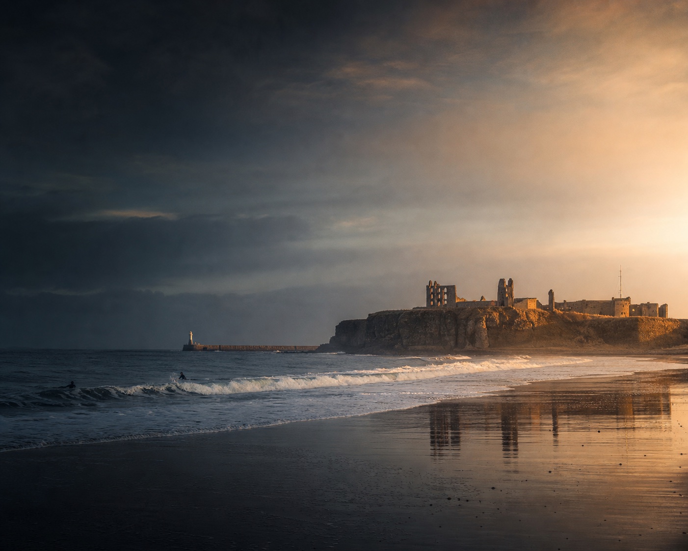 Tynemouth Longsands surf beneath the ruins of Tynemouth Priory and Castle