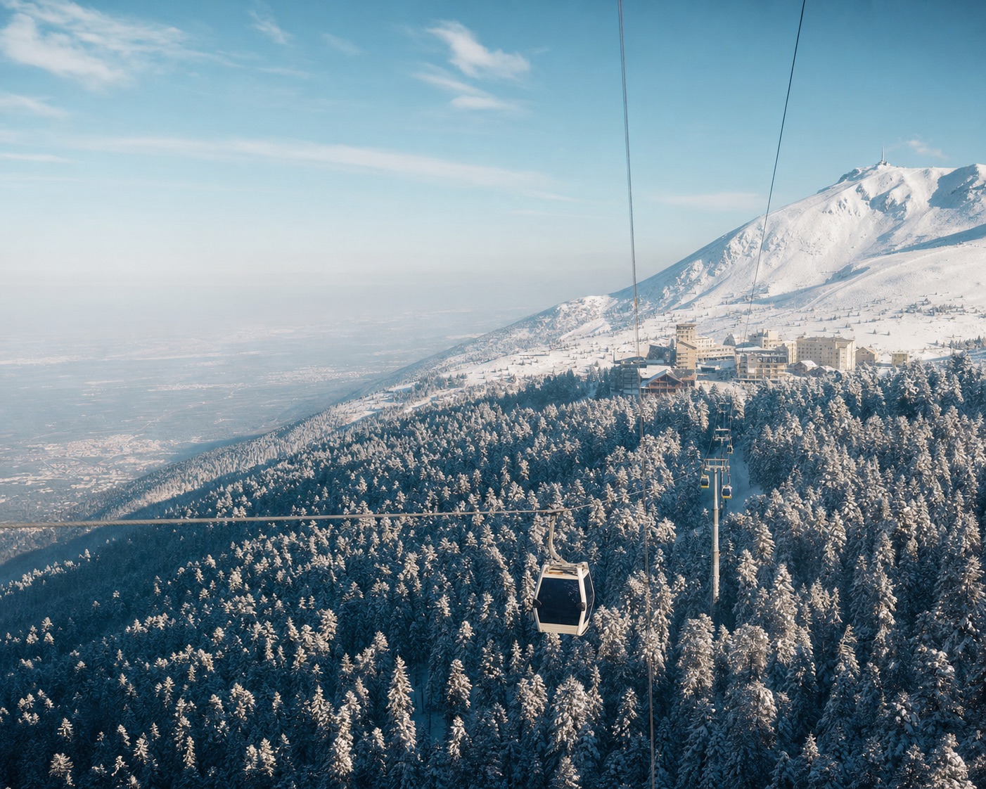 Uludağ gondola crossing snow-covered forest above Bursa