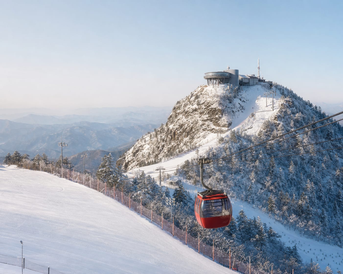 Yongpyong gondola approaching Dragon Peak's rounded summit station