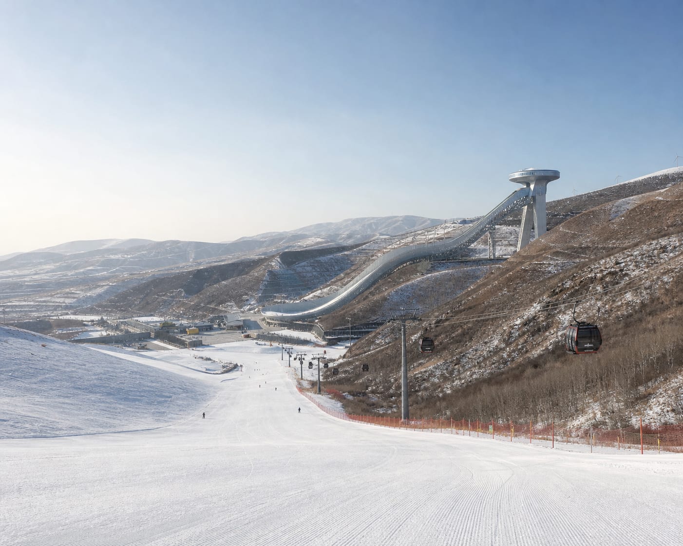 Zhangjiakou's Snow Ruyi ski jump above the dry snowy hills of Chongli